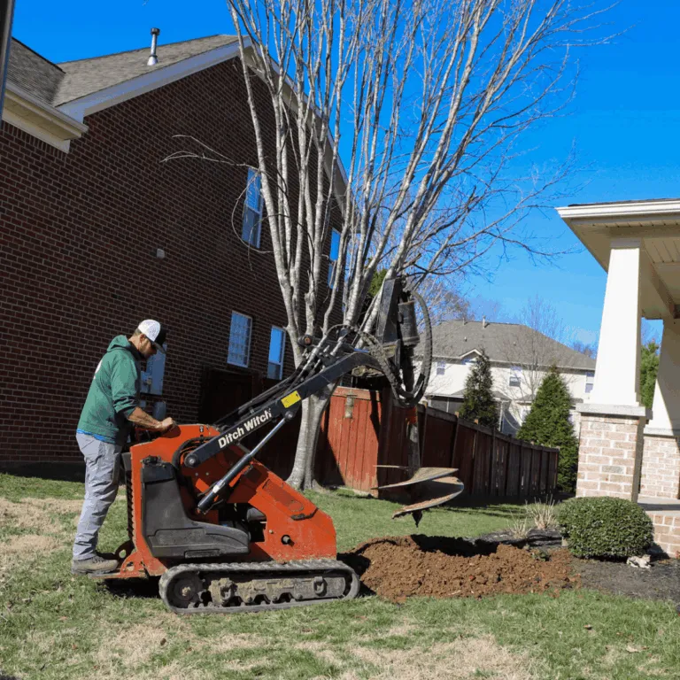 Stump grinding machine clearing a residential yard in West Meade, Nashville